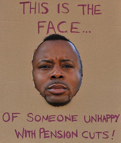 Strikers' placards: A picket stands outside St Thomas' Hospital in central London