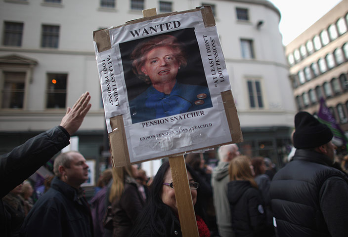 Strikers' placards: A member of the public carries a placard in Liverpool