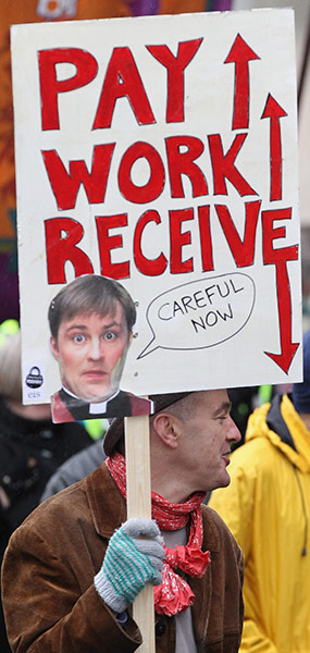 Strikers' placards: Public sector workers at a march in Glasgow