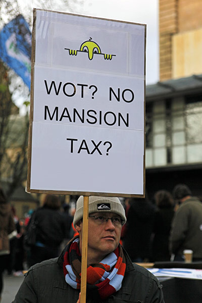 Strikers' placards: A protester at a rally in Nottingham