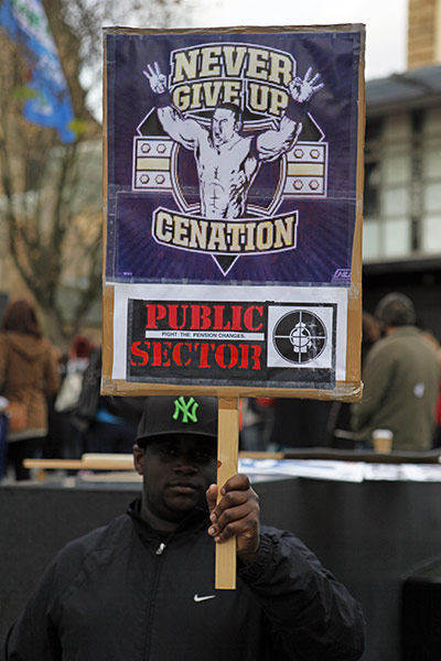 Strikers' placards: A protester at a rally in Nottingham