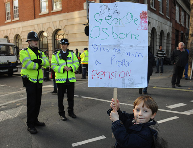 Strikers' placards: A boy at a march in central London