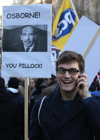 Strikers' placards: A protester on a march in London