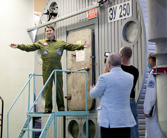 Mars500: An unidentified official poses after closing the hatch, 520 days ago