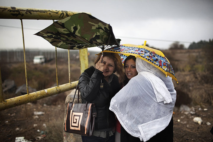 24 hours in pictures: Golan Heights: Relatives wait as A Syrian Druze bride