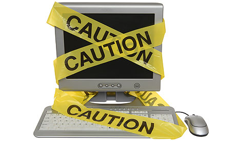 Caution Tape on Computer