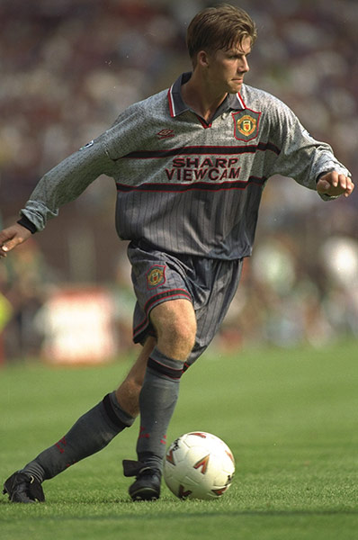 Fergie's 25 years: David Beckham in action for Manchester United in August 1995