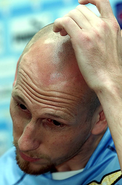 Fergie's 25 years: Lazio's new signing Jaap Stam gestures at a press conference