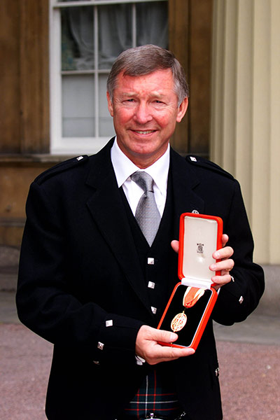 Fergie's 25 years: Manchester United manager Alex Ferguson is knighted by the Queen