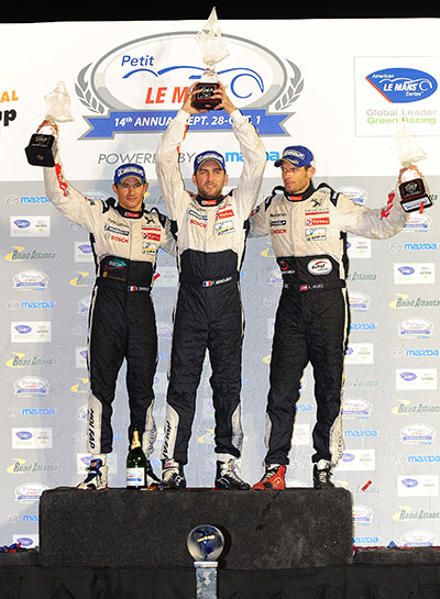 Petit Le Mans: The #8 Peugeot Sport drivers celebrate after winning ALMS Petit Le Mans