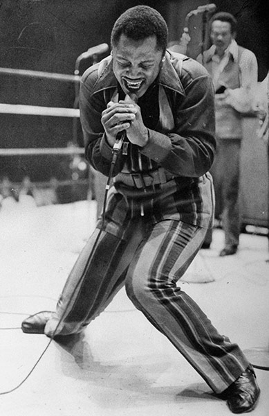 Joe Frazier: Heavyweight champ Joe Frazier sings in the boxing ring