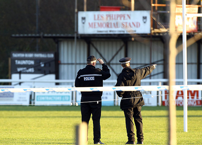 M5 accident: Police officers walk on the pitch at Taunton Rugby Club's ground