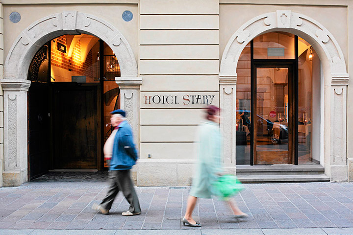 Poland Euro 2012 Update: People walk outside hotel Stary in Krakow