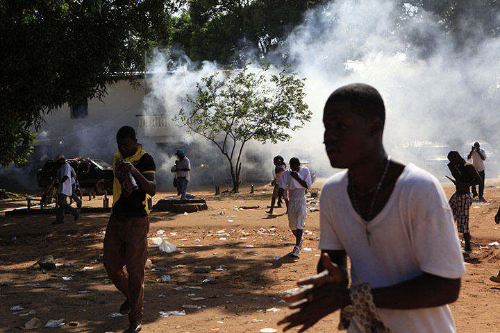 Liberia violence: Opposition party supporters flee their party's headquarters 