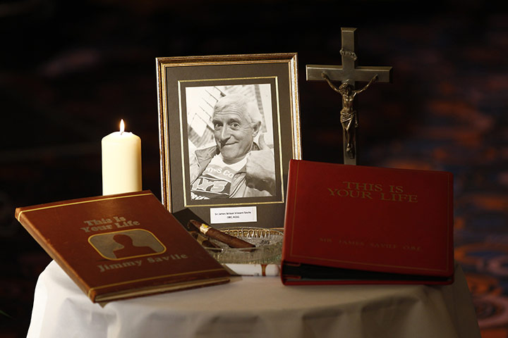 Jimmy Savile funeral: A display on a table by the gold-coloured coffin