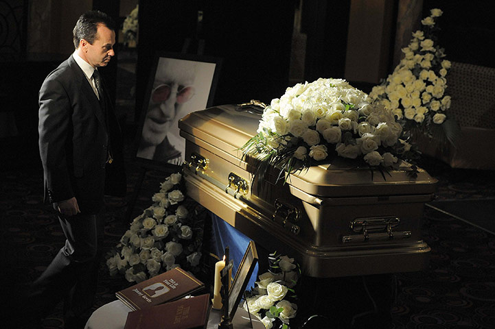 Jimmy Savile funeral: Funeral director Robert Morphet stands by the coffin