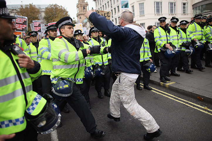 Student protests: A man tussles with police as students take part in a demonstration
