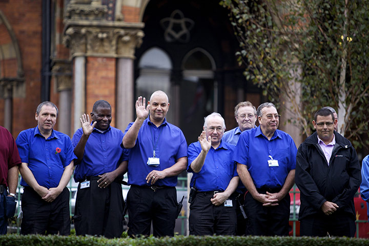 Jimmy Savile funeral: A guard of honour at Leeds General Infirmary waves as the cortege passes