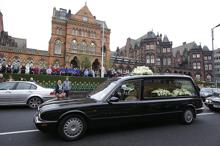 Jimmy Savile funeral: The hearse carrying Sir Jimmy Saville stops for a guard of honour 