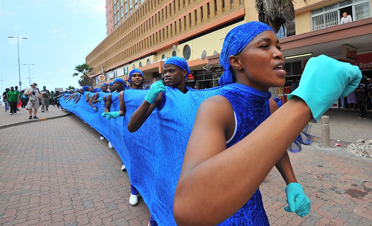 COP17 in Durban:  South African dancers making a blue line lead a 3kms Walk for the Future