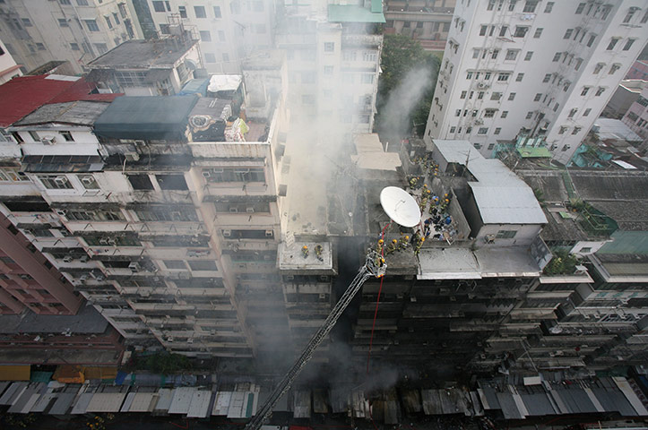 24 hours in pictures: Rescuers and firefighters work at a fire site at Fa Yuen Street, Hong Kong