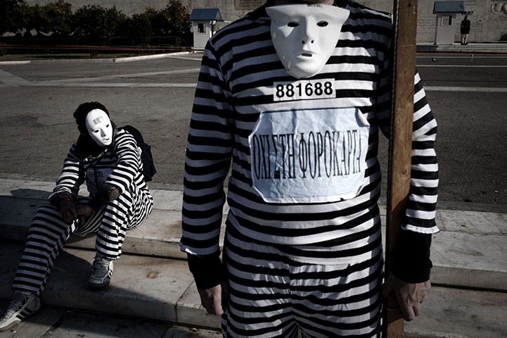 24 hours in pictures: Protesters participate at a demonstration during a 24-hour strike in Athens