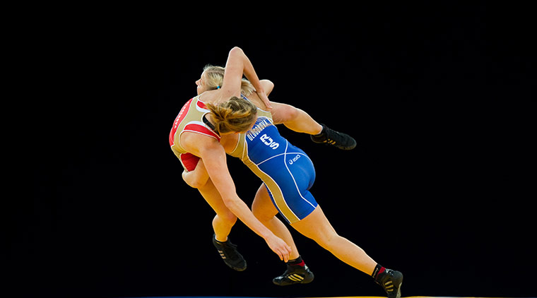 24 hours in pictures: Two competitors run through a selection of wrestling moves