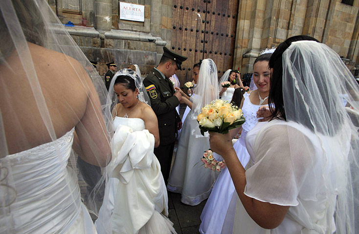 24 hours in pictures: Couples wait to get married at a collective Catholic in Columbia