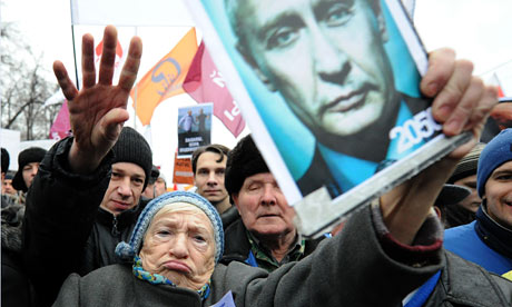 A Russian woman holds an anti-Putin placard in Bolotnaya square