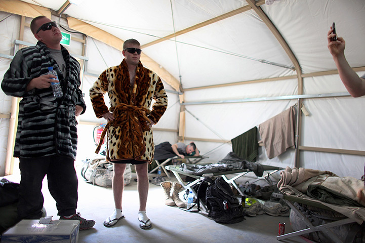 24 hours: Kuwait City, Kuwait: US army soldiers model robes at Camp Virginia