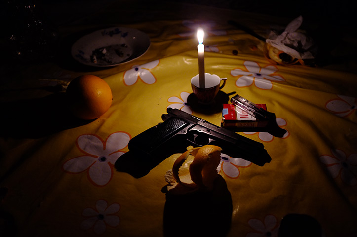 Syria: A pisto in the house of a rebel fighter in Benish 