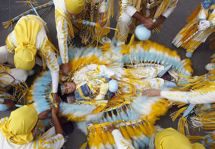24 hours: Ciudad Juarez, Mexico: Ximena, 8, takes part in an Apache dance