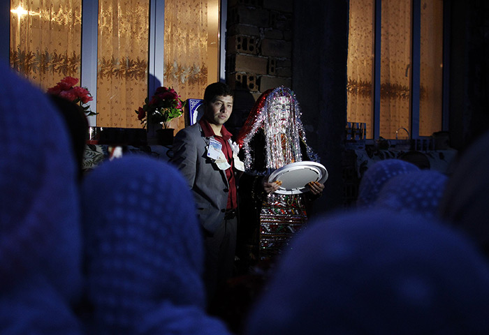 24 hours: Ribnovo, Bulgaria: A Bulgarian Muslim couple pose at their wedding ceremony