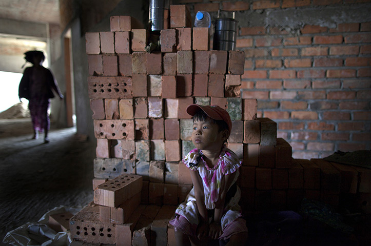 24 hours: Naypyitaw, Burma: A girl waits for her mother at a construction site 