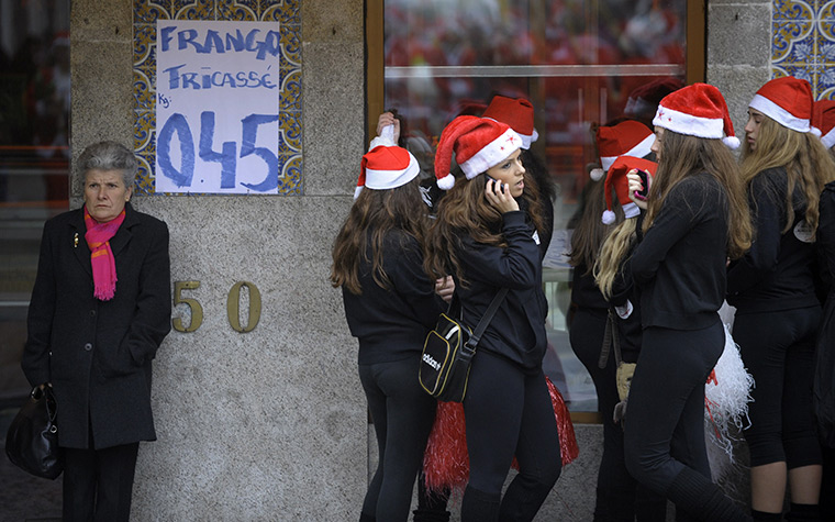 24 hours: Porto, Portugal: People dressed as Santa Claus wait before a parade