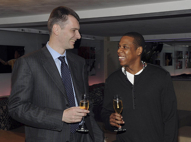 Mikhail Prokhorov: Prokhorov with Jay-Z as they celebrate Prokhorov's purchase of the Nets