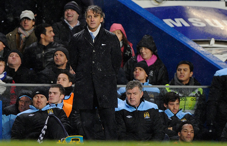 Chelsea v Man City: A sodden Roberto Mancini near the end of the game