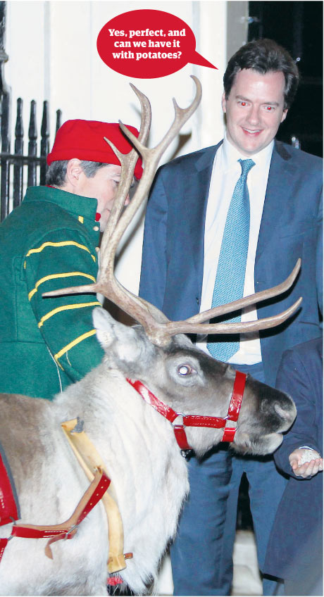 Chancellor George Osborne meets a reindeer in Downing Street.