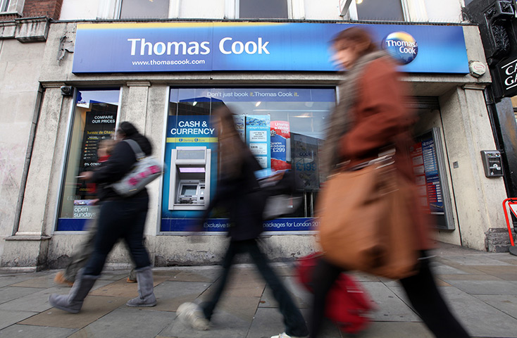 Thomas Cook: Pedestrians pass a branch of Thomas Cook in London