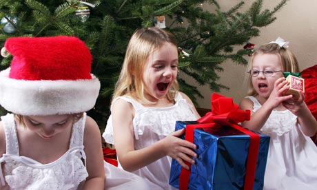 Children opening Christmas presents
