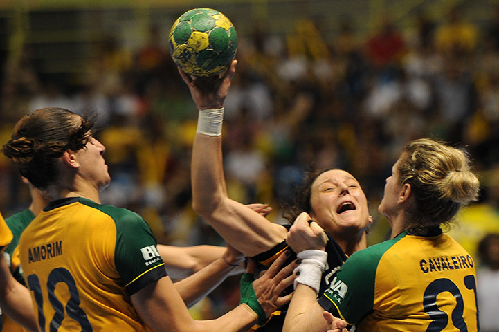 Best of the sport week: Spain's Macarena Aguilar is blocked by Brazil's Cavaleiro and Amorim