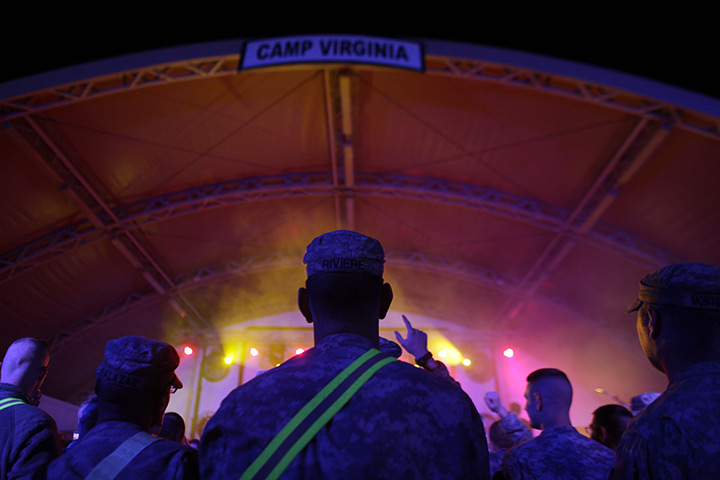24 hours in pictures: Camp Virginia, Kuwait: US army soldiers watch a concert by the band Filter
