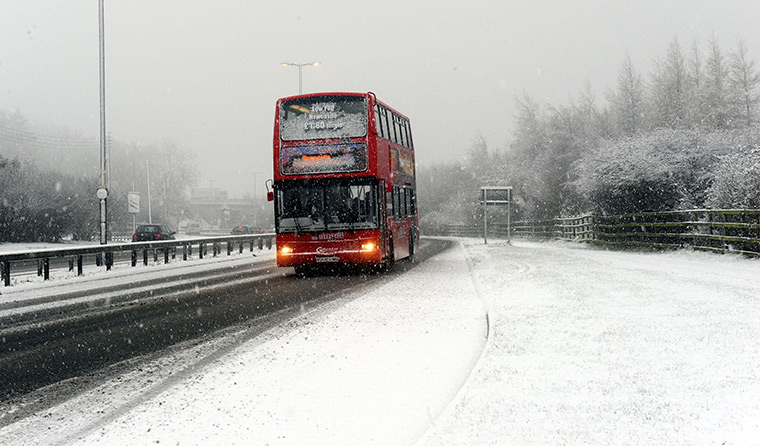 UK Weather: A bus struggles in heavy snow on the roads in Gateshead