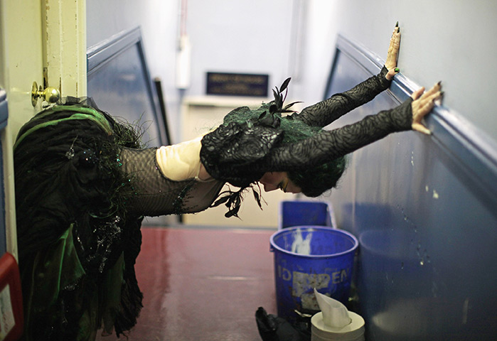 24hours in pictures: Dancer Kara McLaughlin stretches before going on stage