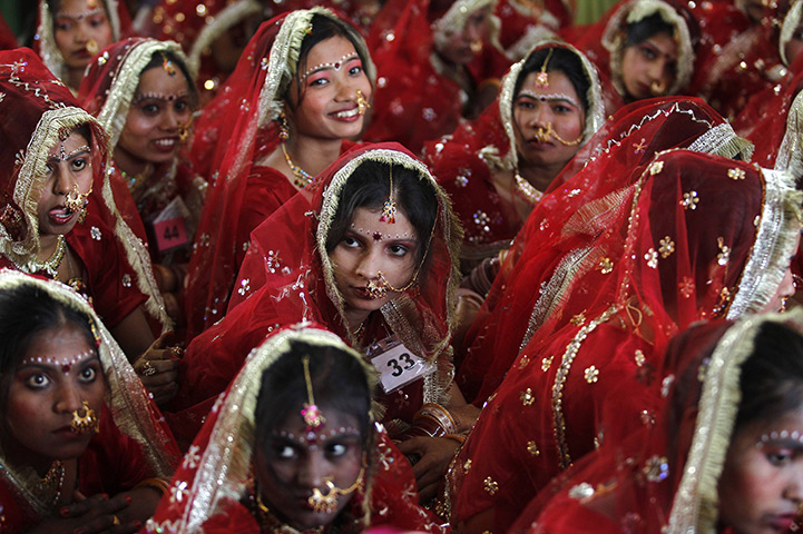 24hours in pictures: Bejeweled brides attend a mass marriage ceremony at Noida