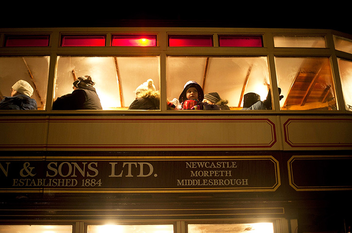 24hours in pictures: Visitors travel by tram at Beamish in Birtley, UK