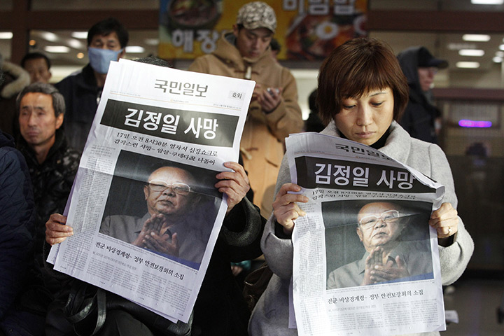 Reaction to Kim Jong il: South Koreans read extras reporting the death of Kim Jong Il