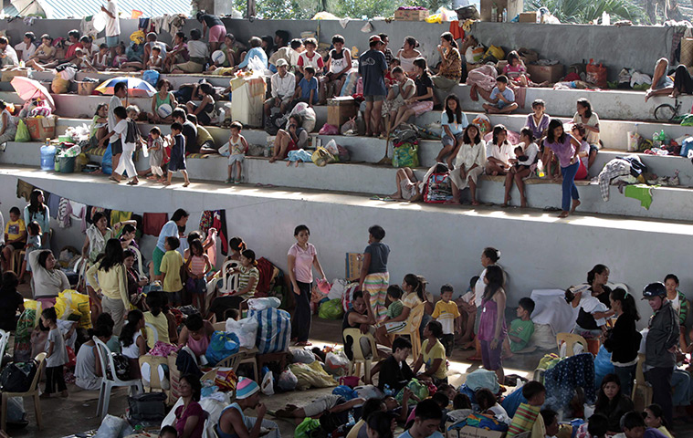 Philippines flooding: A basketball court turned into an evacuation centre in Makasandig village