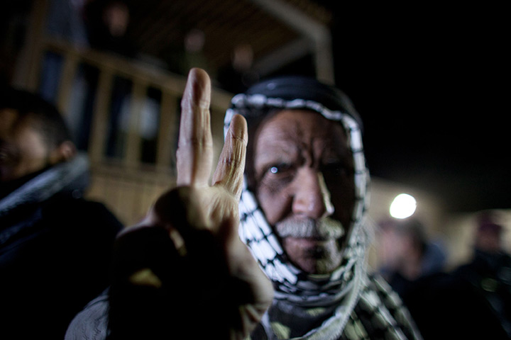 24 hours: Ramallah, West Bank: A Palestinian man makes the victory sign