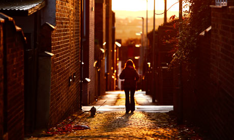 woman walking in alley